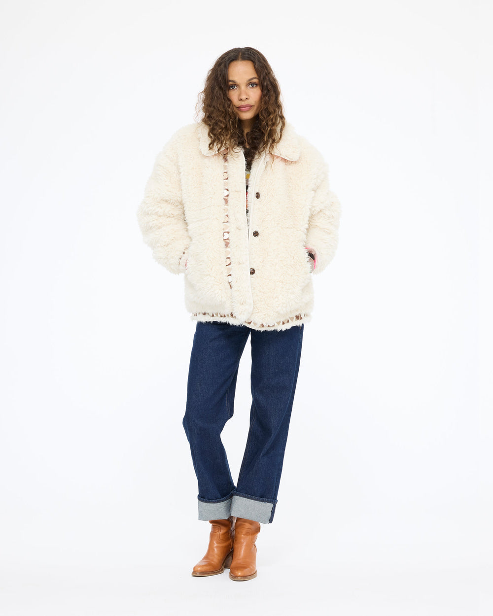 Model wearing the Cloud Nine Jacket in cream sherpa with dark jeans and tan boots, full length front view