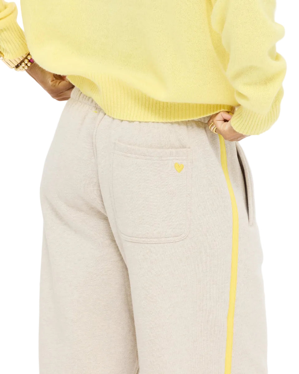 Close-up of the Super Soft Fleece Weekend Palazzo in taupe heather showing the yellow side stripe and pocket, with the Mad Love Mock Neck Sweater