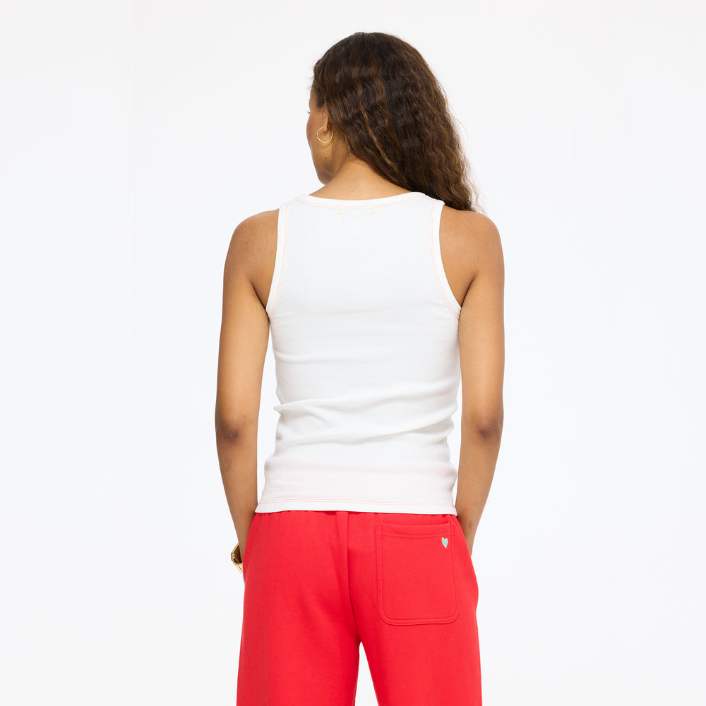 Model wearing the KR Tank in white with the Super Soft Fleece Weekend Palazzo in red, back view