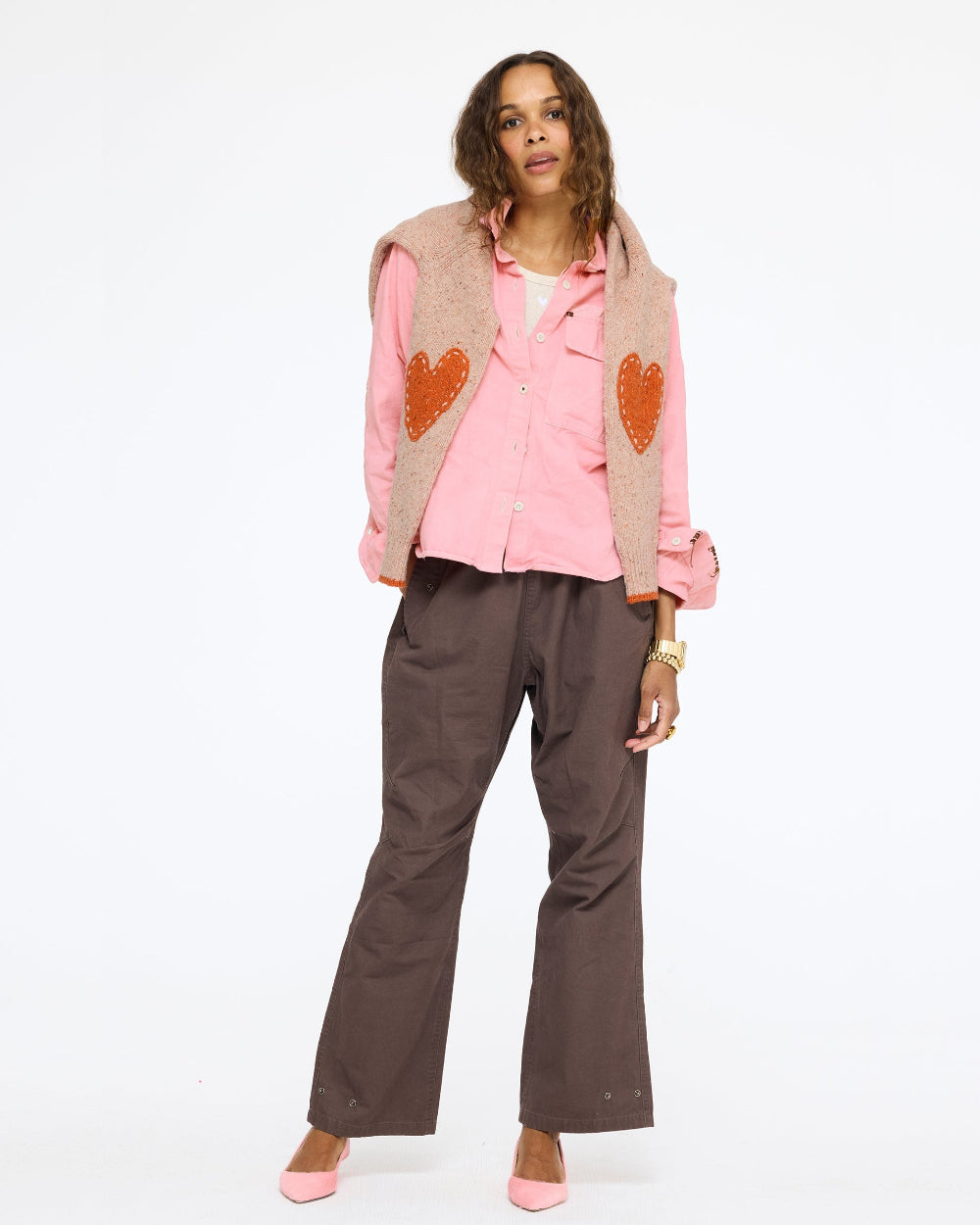 Model wearing the Love Brigade Pant in brown with the Pia Fireside and Kisses Shirt in pink, full length front view