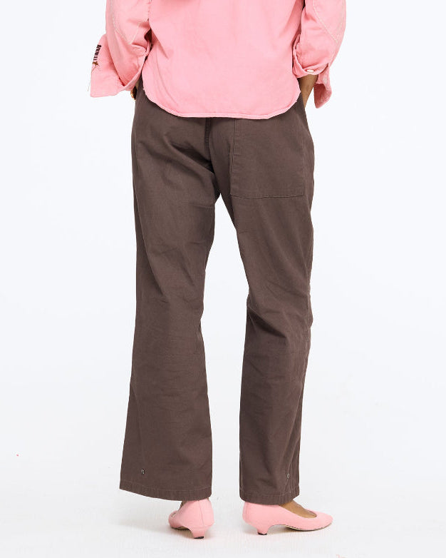 Model wearing the Love Brigade Pant in brown with the Pia Fireside and Kisses Shirt in pink, full length view