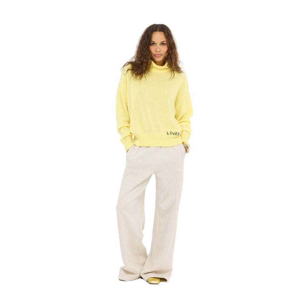 Model wearing the Mad Love Mock Neck Sweater in golden yellow with the Super Soft Fleece Weekend Palazzo in taupe heather, full length front view