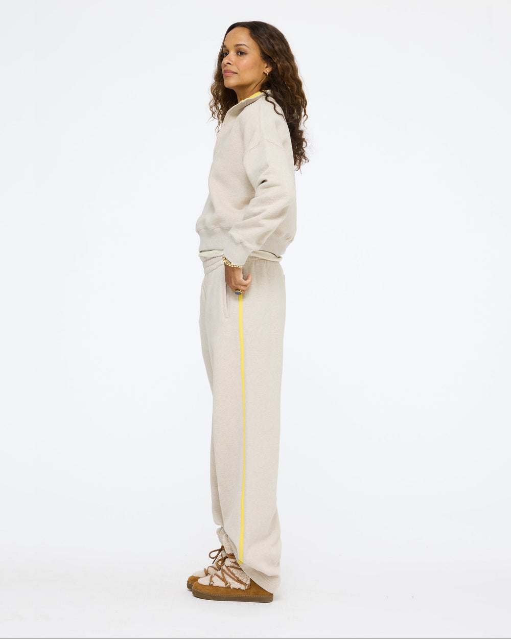 Model wearing the Sunday Quarter Zip Sweatshirt in taupe heather with the Super Soft Fleece Weekend Palazzo in taupe heather, side view
