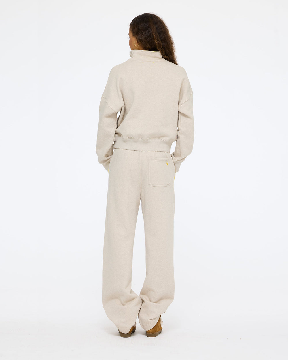 Model wearing the Sunday Quarter Zip Sweatshirt in taupe heather with the Super Soft Fleece Weekend Palazzo in taupe heather, back view