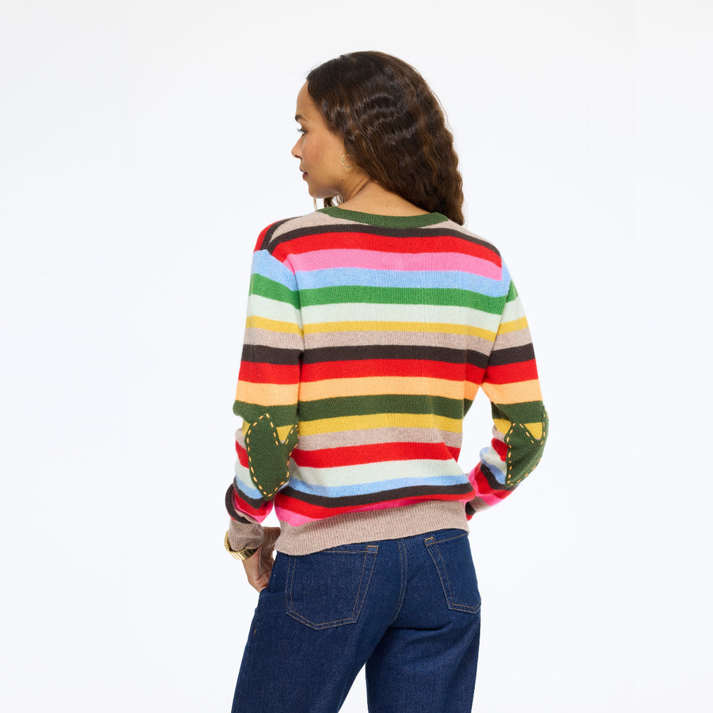 Model wearing the Patchwork Pullover Stripe Sweater in multicolor stripe with jeans, back view