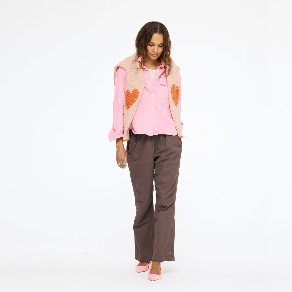 Model wearing the Pia Fireside and Kisses Shirt in pink with the Love Brigade Pant in brown, full length front view