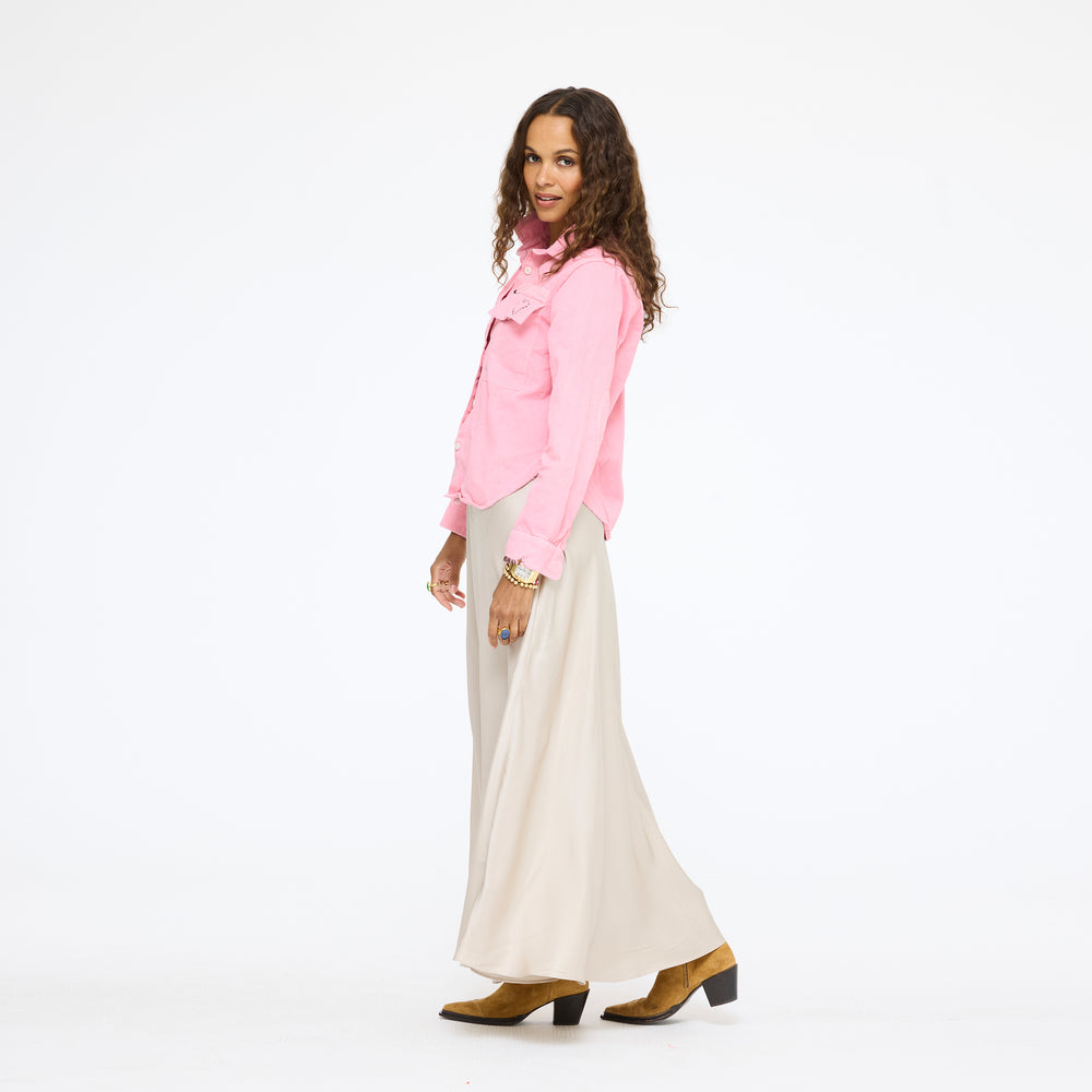 Model wearing the Pia Fireside and Kisses Shirt in pink with the Ali Maxi Skirt in taupe and tan boots, side view