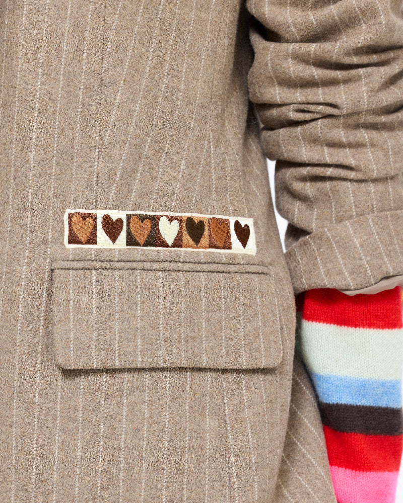 Model wearing the Workday Love Brigade Blazer in taupe pinstripe with jeans
