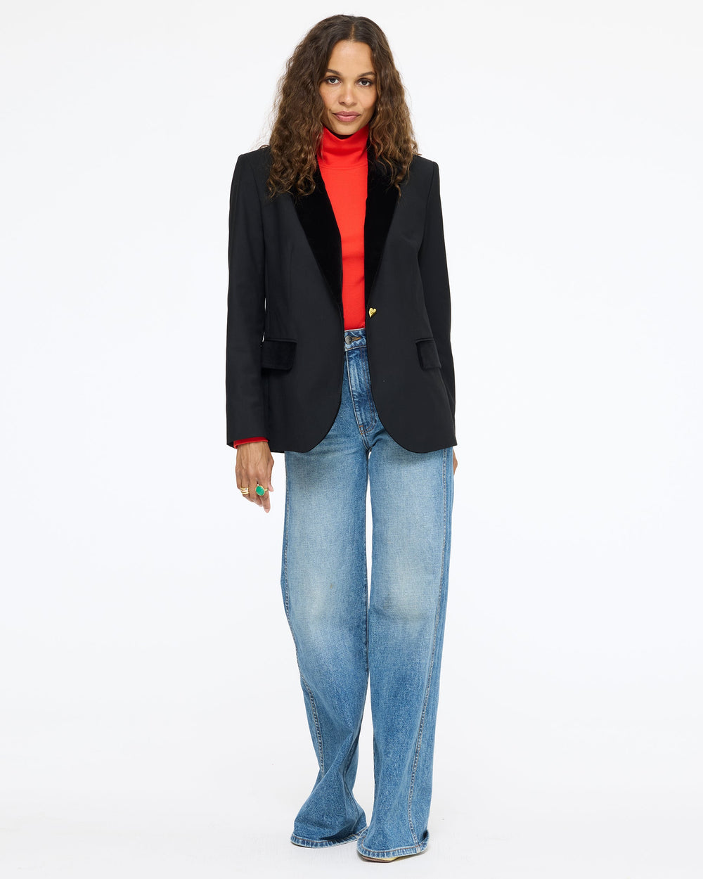Model wearing the Workday Fancy Blazer in black with a red top and wide-leg jeans, full length front view