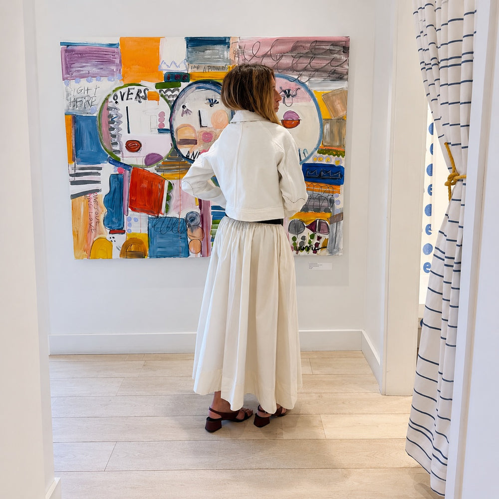woman-wearing-white-denim-jacket-and dress