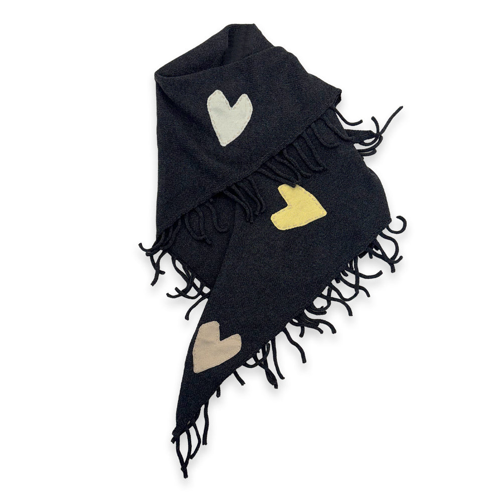 Flat view of the Love Nest Zero Waste Wrap in black with patchwork hearts and fringe edges