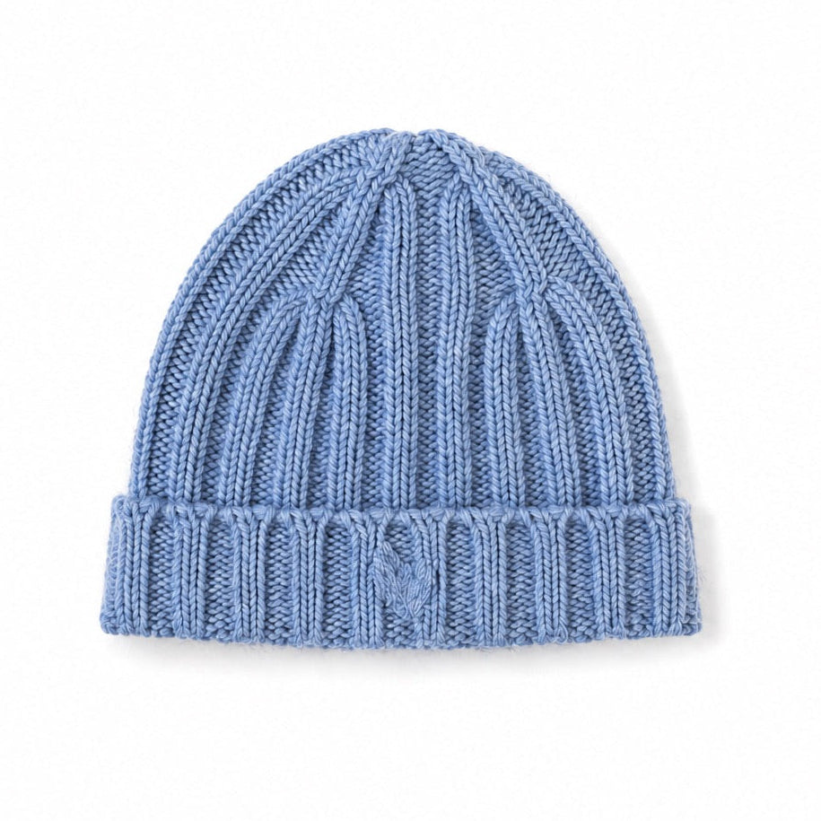 Flat view of the Winter Beanie in blue with a ribbed knit and foldover brim