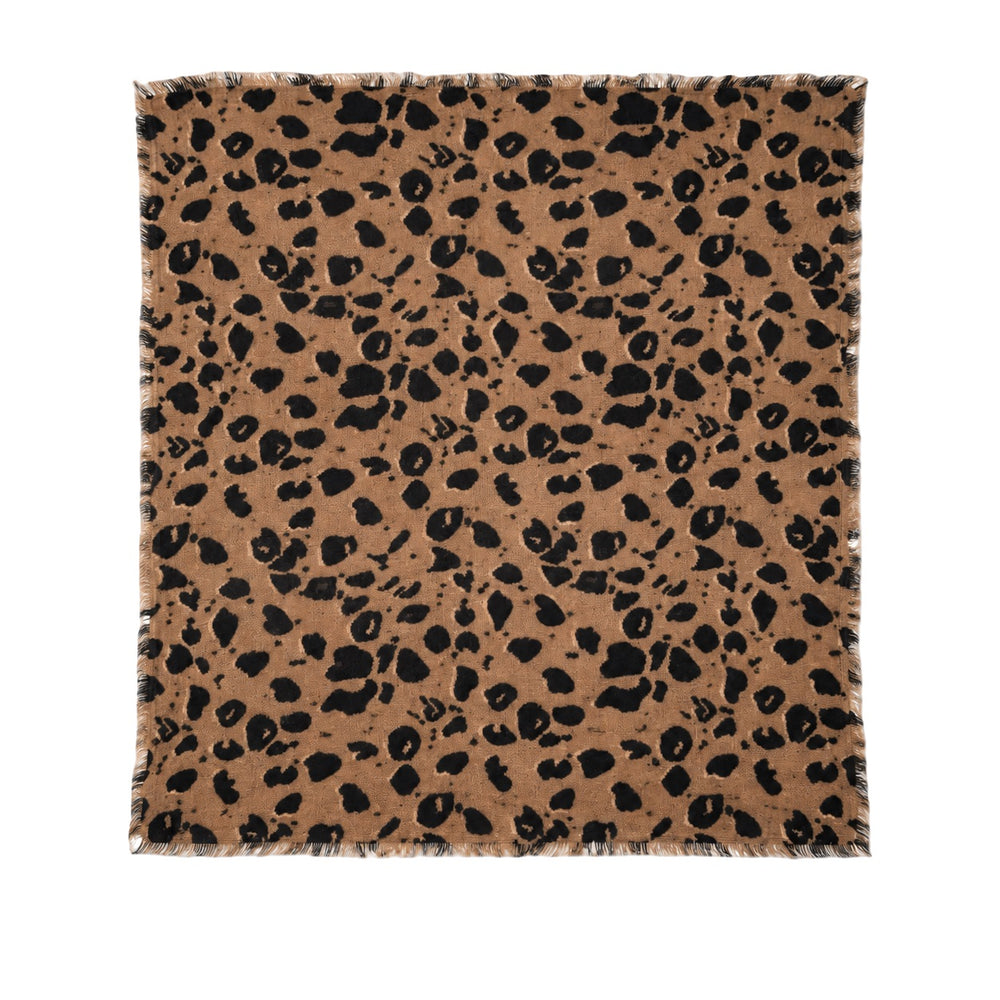 Kerri Rosenthal leopard print bandana worn tied around the neck over a denim jacket, alternate view