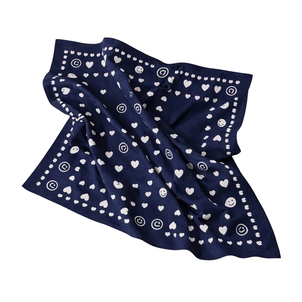 Blue bandana scarf with white heart and dot print.
