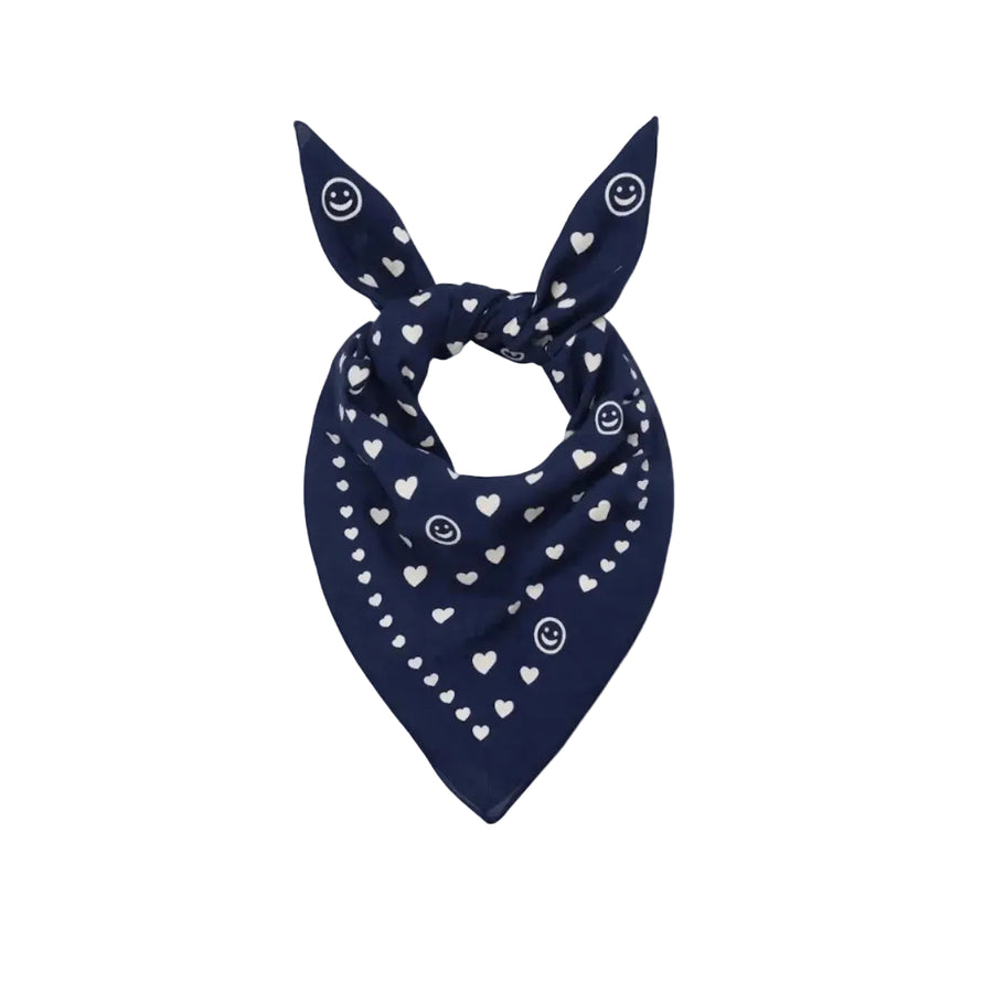Blue bandana scarf with white heart and dot print, tied in a knot.
