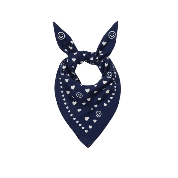 Blue bandana scarf with white heart and dot print, tied in a knot.