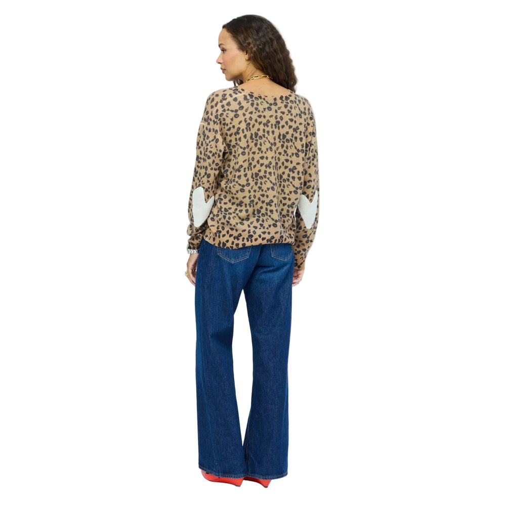 Kerri Rosenthal leopard print top back view, styled with wide-leg denim