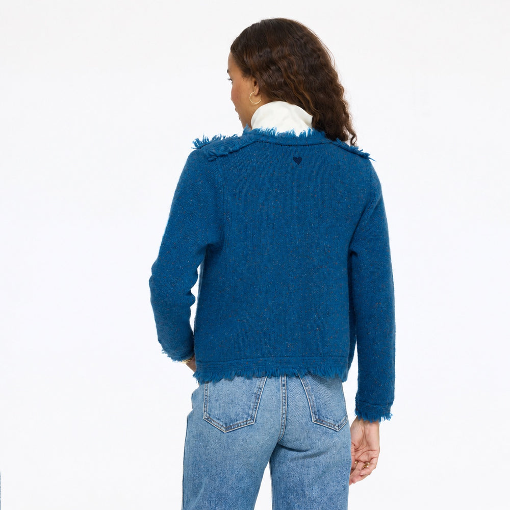 Model wearing the Fringe Beau-Lero in electric blue with jeans, back view