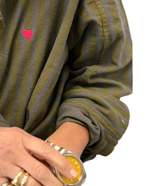 Kerri Rosenthal women's olive green button-down shirt, close-up styled with gold jewelry.