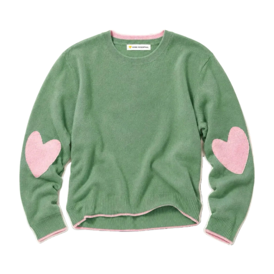 Green cashmere sweater flat lay showing crewneck, ribbed hem, and pink heart elbow patches