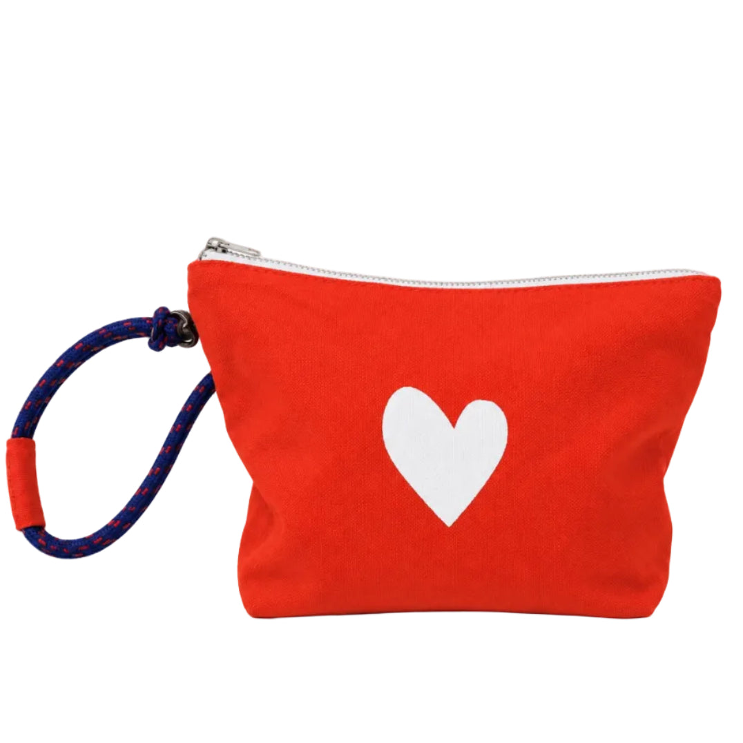 A red canvas zippered pouch with a white heart printed on the front, featuring a blue and red braided wrist strap with a red connector, set against a plain white background.