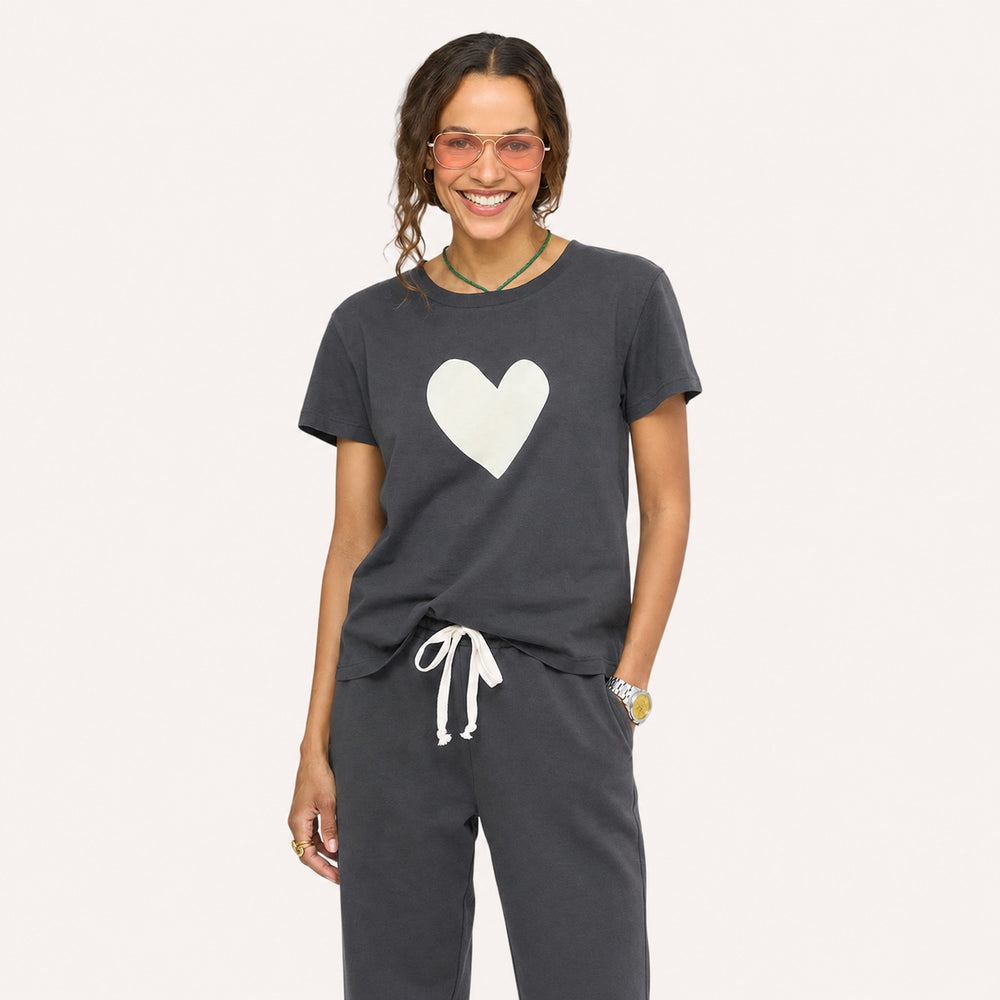 Woman wearing Suke imperfect heart coal tee in 100% cotton with matching sweatpants- Shop women's chic tops & tees by Kerri Rosenthal