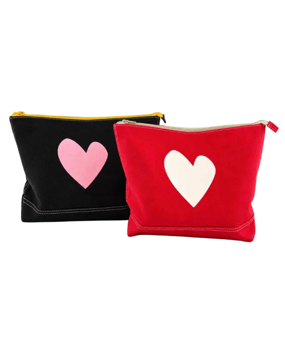 Jumbo Love Clutch in black with a pink heart beside the Jumbo Love Clutch in red with a white heart