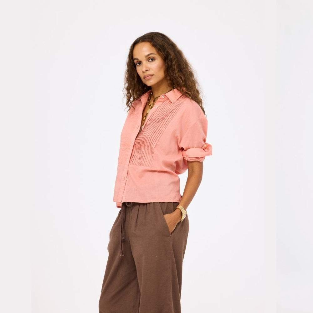 Kerri Rosenthal Tux Shirt in Cali Rose cotton voile with pintucked front and French cuffs with brown palazzo pants.